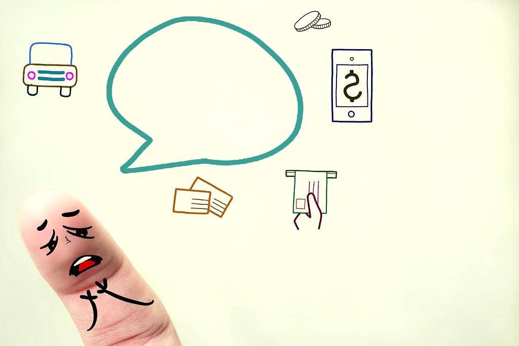 Happy European family planning their budget together at kitchen table with laptop and documents